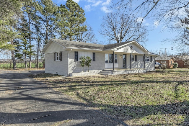 single story home with a porch and a front yard