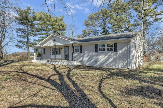 ranch-style home with a porch and a front yard