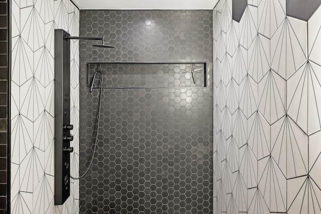 bathroom with tiled shower