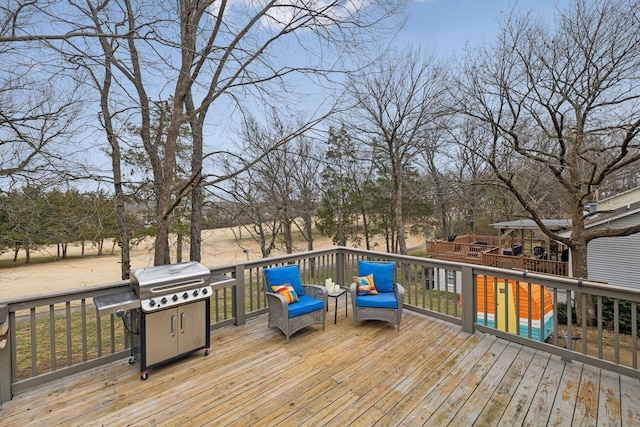 wooden deck with area for grilling