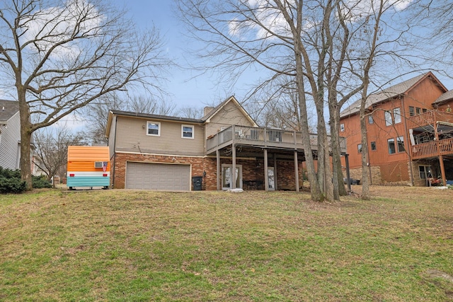 view of front of house with a front yard, a garage, and a wooden deck