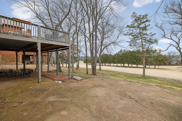 view of yard with a wooden deck