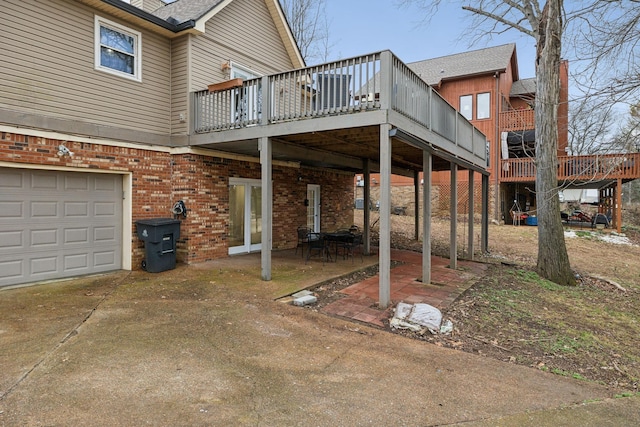 exterior space featuring a wooden deck and a garage