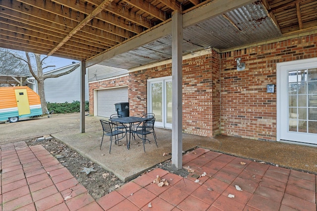 view of patio / terrace featuring a garage