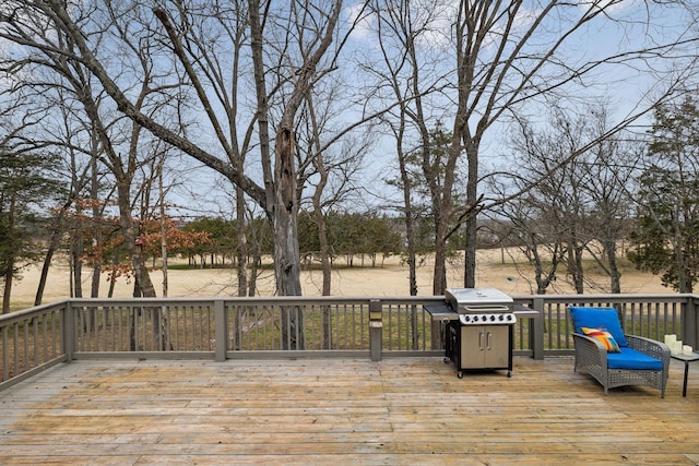 wooden terrace featuring grilling area