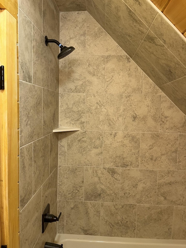 interior details with tiled shower / bath