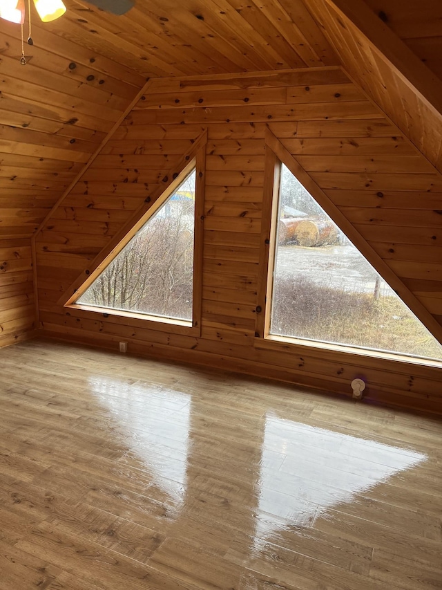 bonus room with wood ceiling, lofted ceiling, and light hardwood / wood-style floors