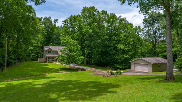 view of yard with an outbuilding and a garage