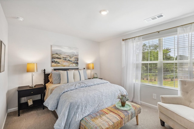 bedroom featuring carpet flooring, baseboards, and visible vents