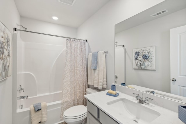 bathroom with visible vents, shower / tub combo, toilet, and vanity