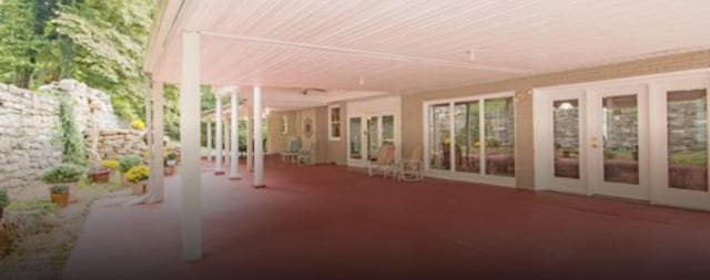 unfurnished sunroom featuring french doors