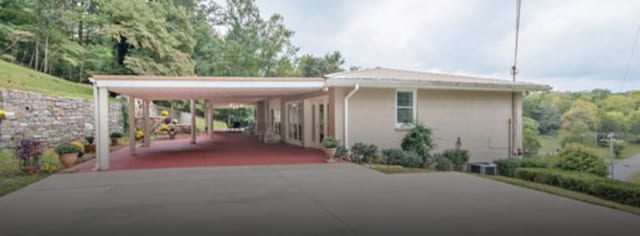 exterior space with a carport