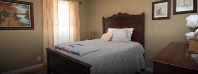 bedroom with wood-type flooring