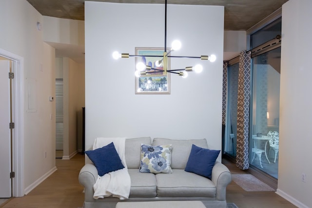 living room featuring a chandelier and light hardwood / wood-style floors