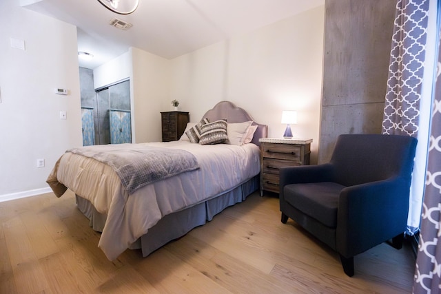 bedroom with light hardwood / wood-style flooring