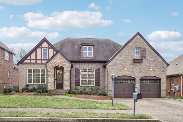 view of front of house with a front lawn and a garage