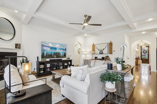 living room with ceiling fan, beam ceiling, dark hardwood / wood-style floors, and coffered ceiling