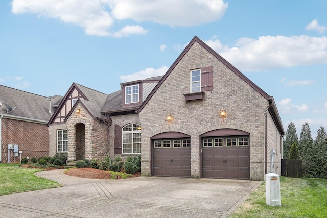 view of front of house featuring a front yard and a garage