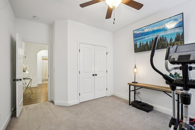 interior space with light colored carpet and ceiling fan