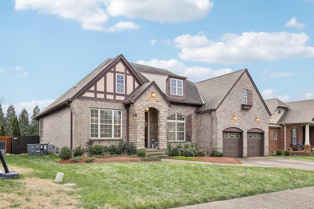 view of front facade featuring a front yard and a garage