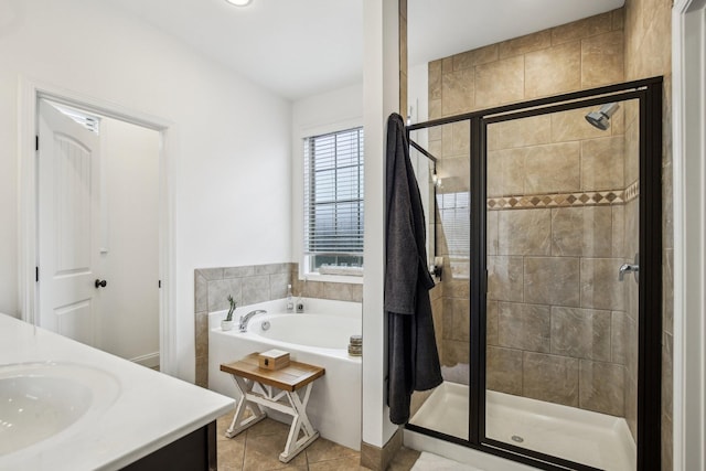 bathroom with vanity, tile patterned flooring, and plus walk in shower