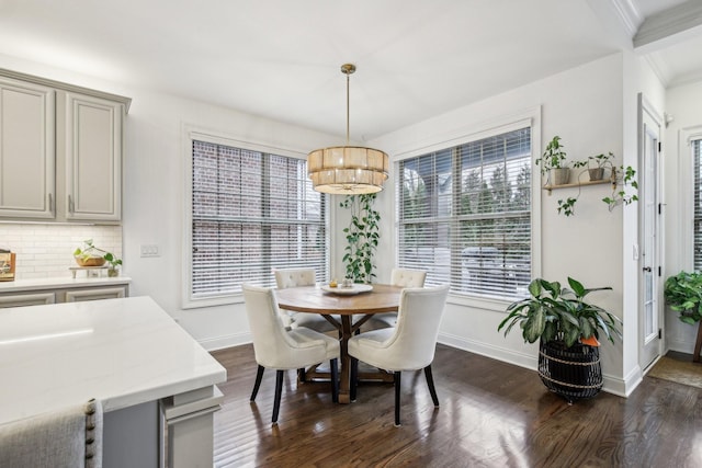 dining space featuring a chandelier and dark hardwood / wood-style flooring