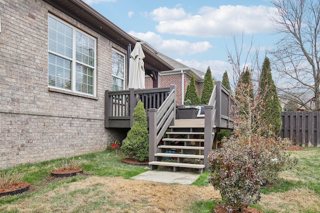 view of home's exterior with a yard and a wooden deck