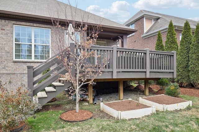 rear view of house featuring a wooden deck