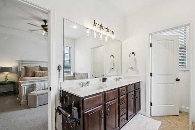 bathroom featuring ceiling fan, tile patterned flooring, and vanity