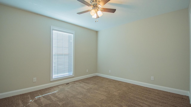 carpeted empty room with ceiling fan