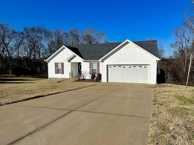 ranch-style house featuring a garage and a front lawn