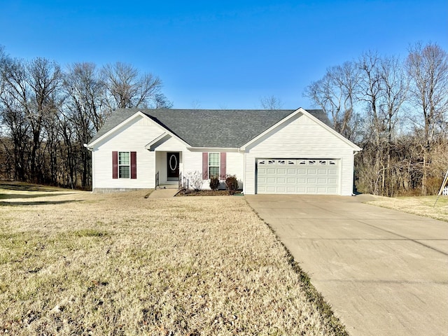 320 Northridge Dr, Pulaski, TN 38478 - view of front of property featuring a garage, a front lawn, driveway, and roof with shingles