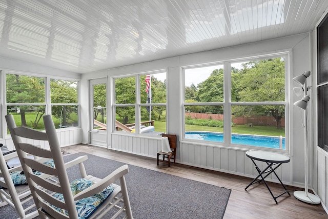 sunroom with vaulted ceiling