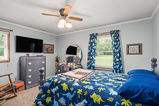 carpeted bedroom featuring ceiling fan and crown molding