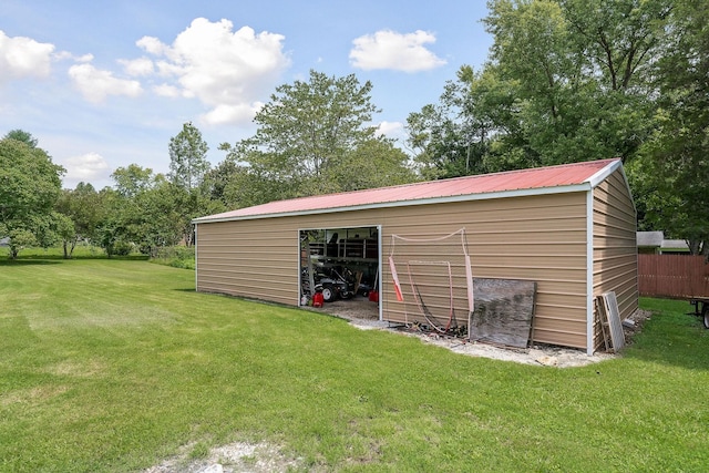 view of outbuilding featuring a lawn