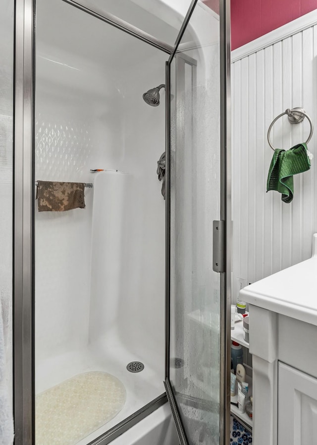 bathroom with a shower with shower door