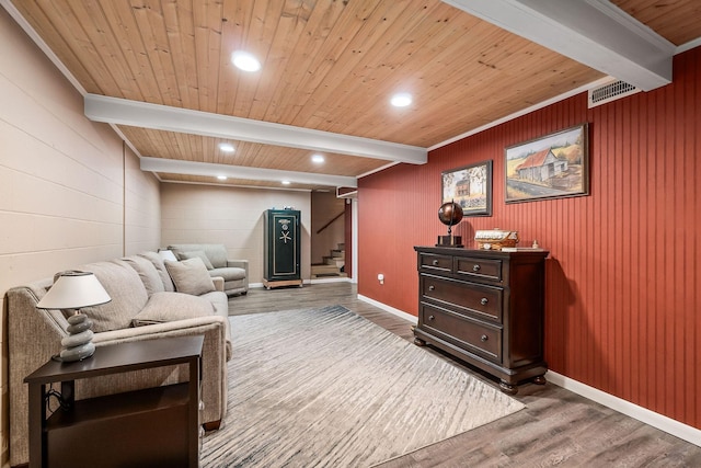 sitting room with beamed ceiling, hardwood / wood-style floors, and wood ceiling