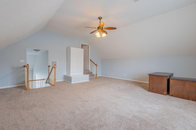 additional living space with ceiling fan, lofted ceiling, and light carpet