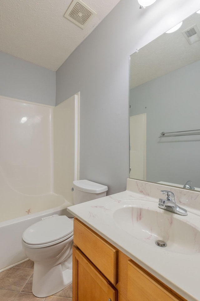 full bathroom with vanity, toilet, a textured ceiling, and  shower combination