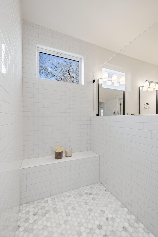 bathroom with a tile shower