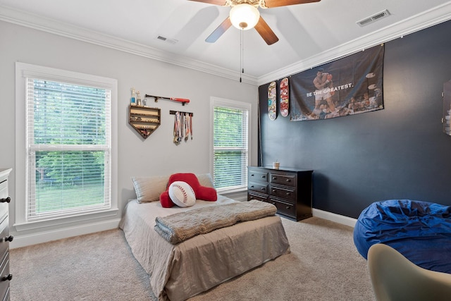 bedroom with ceiling fan, light colored carpet, and ornamental molding