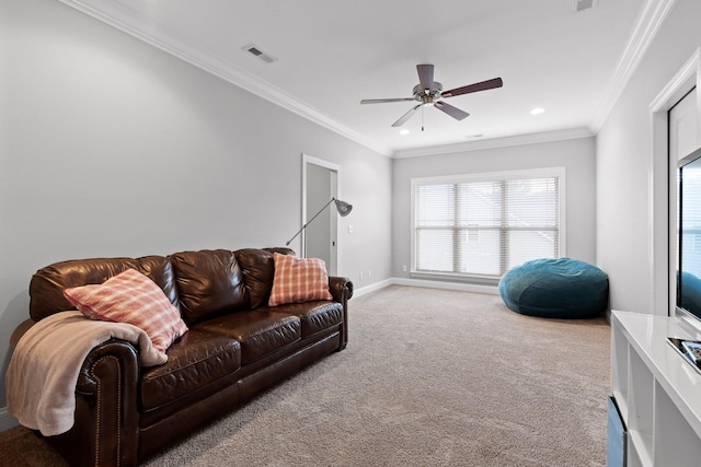 living room with carpet floors, ceiling fan, and ornamental molding