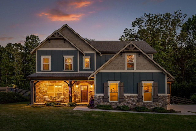 craftsman-style home with a yard and a porch