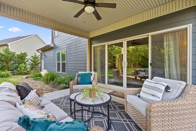 view of patio / terrace with ceiling fan and an outdoor living space