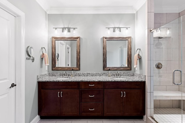 bathroom with vanity, tile patterned floors, an enclosed shower, and ornamental molding