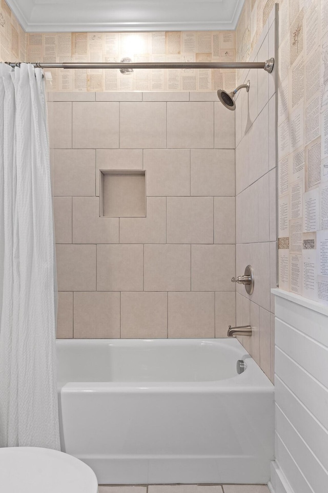 bathroom with ornamental molding, shower / bath combo, and toilet