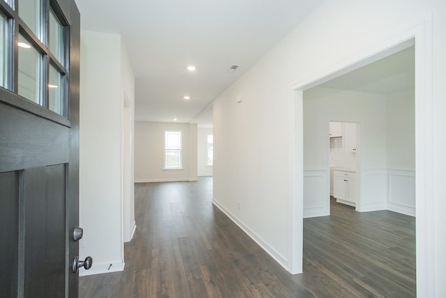 corridor featuring dark hardwood / wood-style flooring