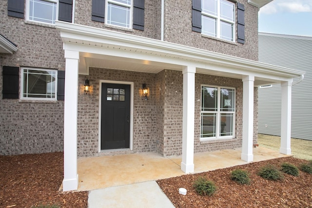 entrance to property with covered porch