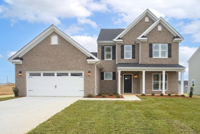 craftsman-style home with a garage, covered porch, and a front lawn