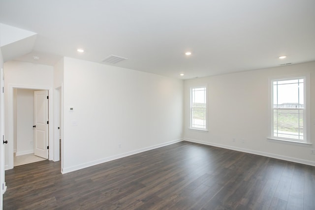 unfurnished room featuring dark hardwood / wood-style flooring